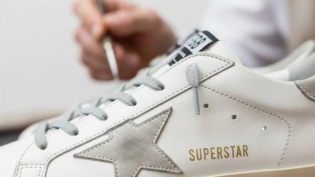 A close-up image showcasing the high-quality Italian leather and hand-distressed details of a Golden Goose Superstar sneaker.